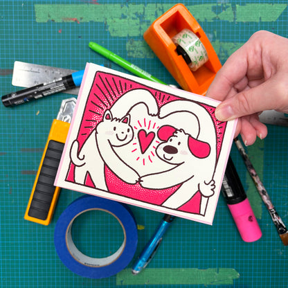 Dog and Cat Heart Pose Greeting Card